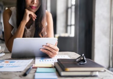 Business person planning and analyse data on laptop