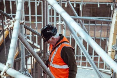 man wearing orange safety vest