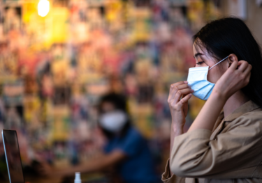 A woman wearing mask to protect herself from Covid
