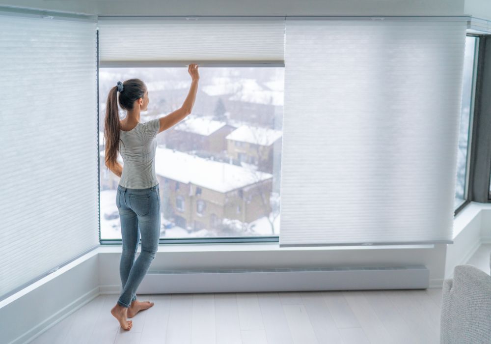 Women closing window shading