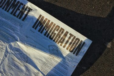 immigration text printed on a paper